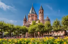 Ancient cathedral in Meinz, Germany surrounded by spring flowers