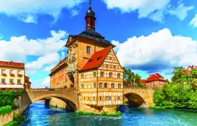 City Hall building with two bridges over the Regnitz river in Bamberg town, Germany